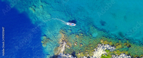 Aerial drone ultra wide photo of famous paradise rocky bay and beach of Anthony Quinn in Rodos island, Dodecanese, Greece