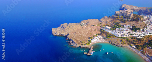 Aerial drone ultra wide photo of famous castle and village of Lindos, Rodos island, Dodecanese, Greece