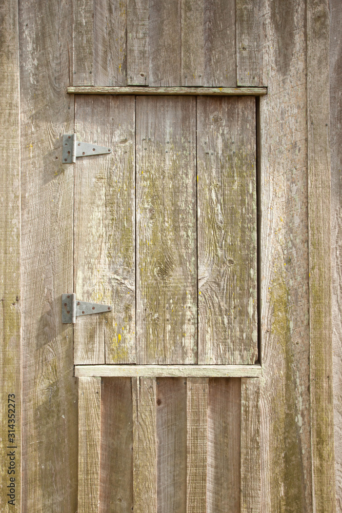 Weathered wood window in the sunshine