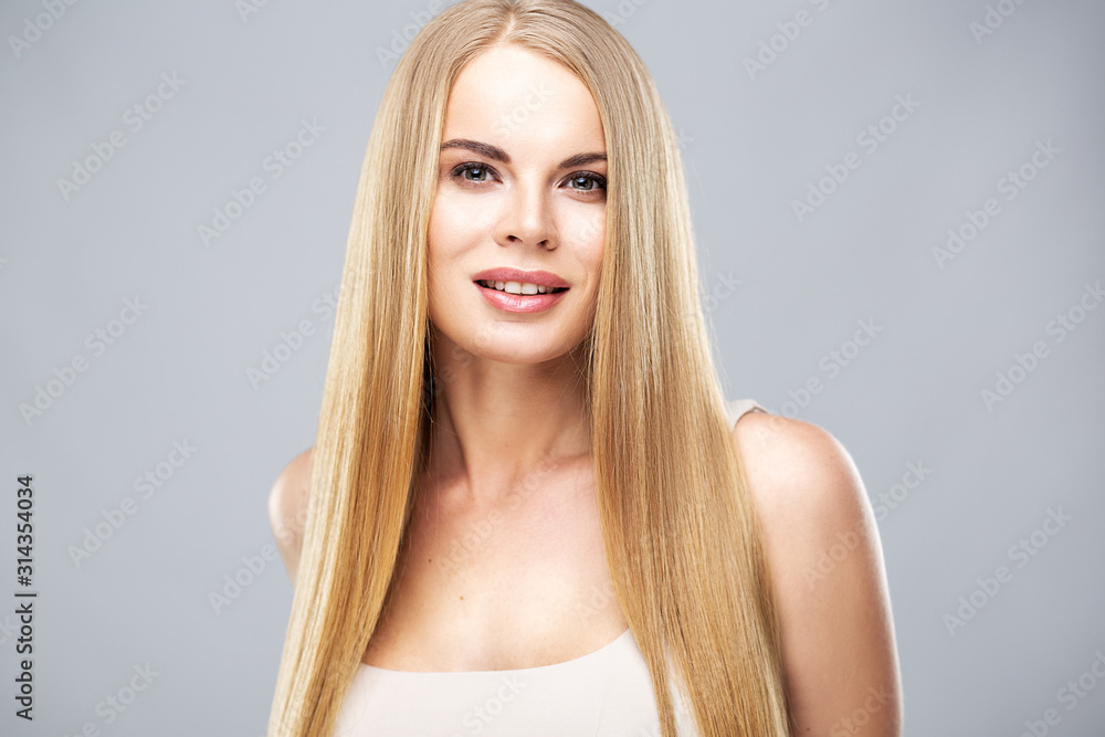 Beautiful blonde woman with shiny long straight hair and natural fresh make up. Fashion beauty portrait isolated Beautiful blonde woman with shiny long straight hair and natural fresh make up. Fashion beauty portrait isolated