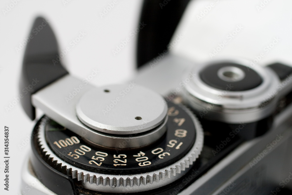 Classic analog single-lens reflex camera isolated on white background