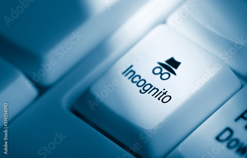 Computer keyboard with Blue toned key with incognito button with text and icon, for private surfing the internet
