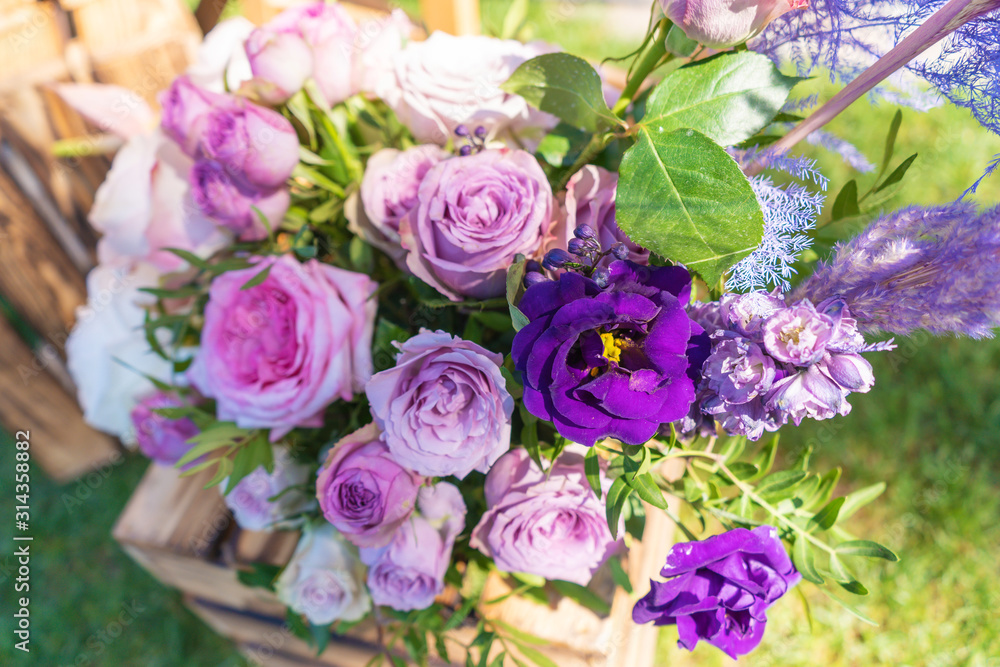 Bouquets of fresh flowers decoration of the festive table. Celebrating an open air party. Decor Details