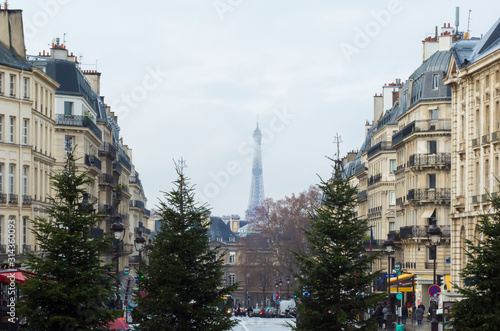 A street in Paris in winter with the Eiffel Tower in the background