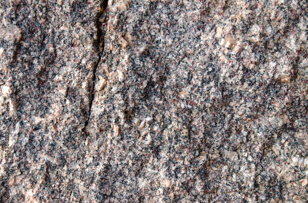 texture old granite wall. background close-up texture old granite wall. background close-up