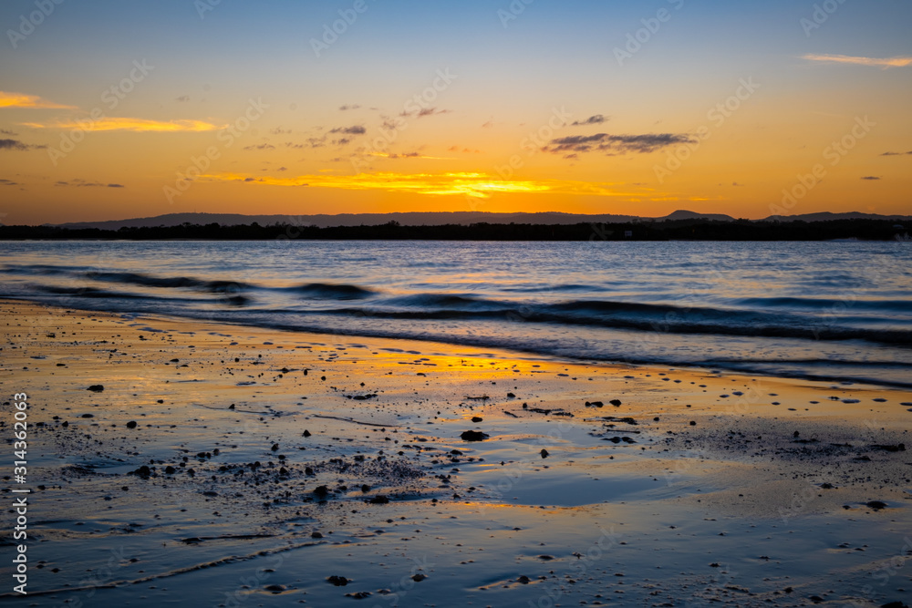 Beautiful evening sunset at Stradbroke Island overlooking the ocean and shoreline