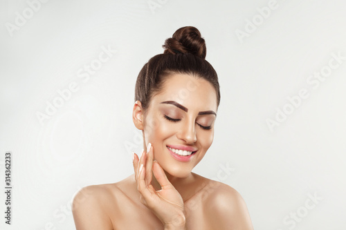 Portrait of woman with beauty face and perfect skin on white background. Skin care. Cosmetology, beauty and spa.