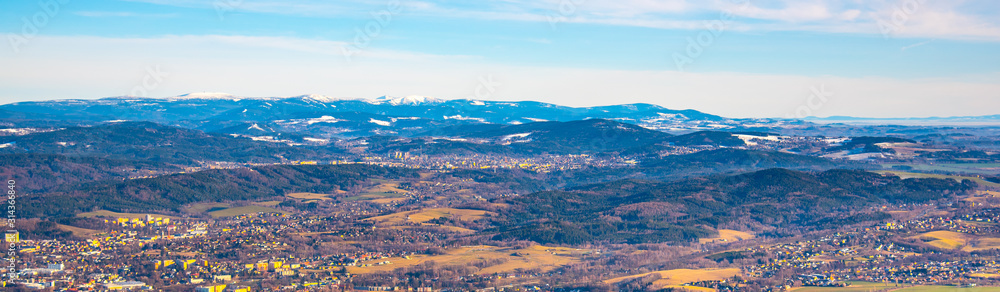 Panoramic view of winter Giant Mountains, Czech: Krkonose, from Jested Mountain. With Jablonec nad Nisou in the foreground, Czech Republic