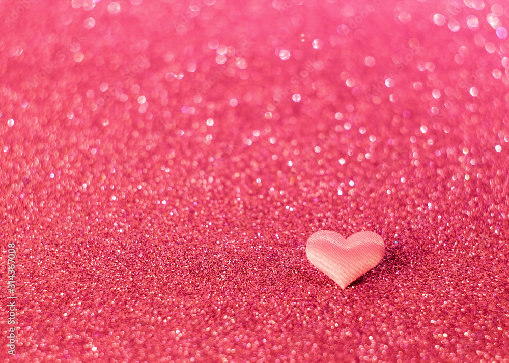 pink heart on a blurry, not sharp pink background with bokeh. Place for text. Valentine's Day