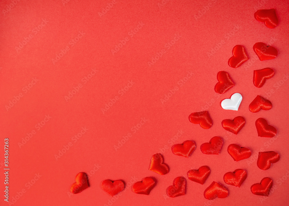 Red hearts for Valentine's Day on a red background with a white heart
