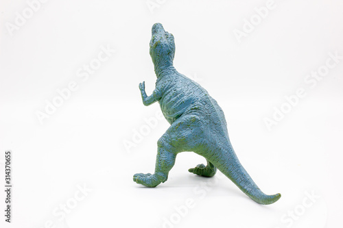 Plastic Dinosaur Isolated on White Background, Tyrannosaurus Rex Toy. 