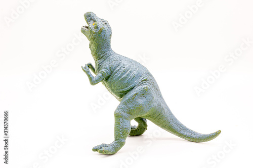 Plastic Dinosaur Isolated on White Background  Tyrannosaurus Rex Toy. 
