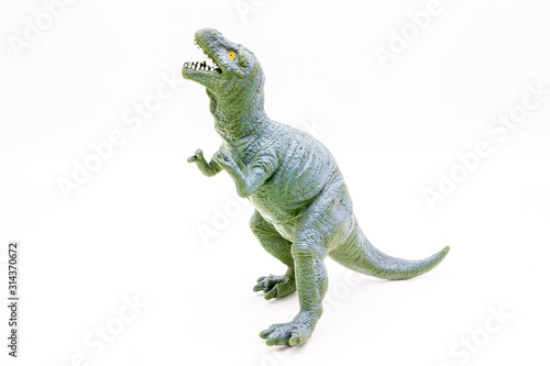 Plastic Dinosaur Isolated on White Background, Tyrannosaurus Rex Toy. 