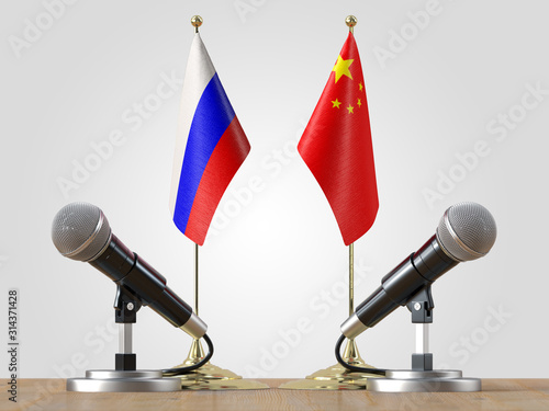 Microphones and flags pair on a desk over isolated background.3d illustration