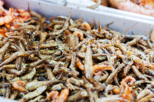 Fried anchovies in market or food festival, asian market