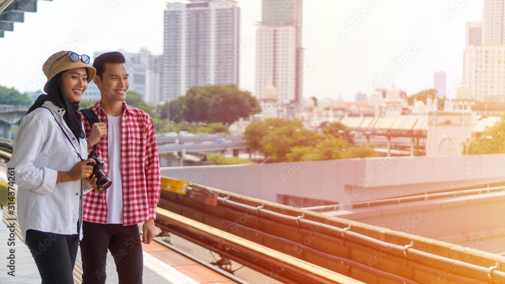 Fototapeta premium Travel Concept, Muslim Tourist Couple at Kuala Lumpur
