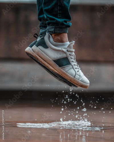 jumping on a puddle in the rain