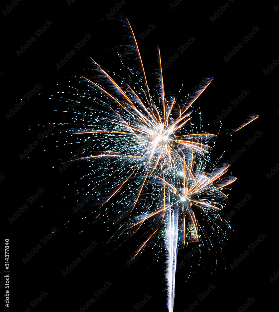 Big fireworks in the form of diverging orange and blue threads isolated on a black background Big fireworks in the form of diverging orange and blue threads isolated on a black background