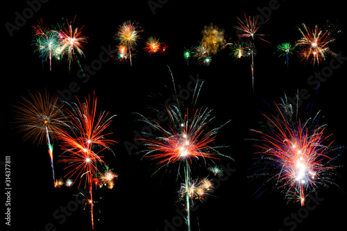 Set of unique burning festive fireworks glowing in different colors isolated on black background