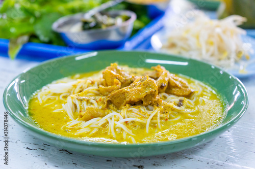 Kanomjeen rice noodle with thai curry with chicken photo
