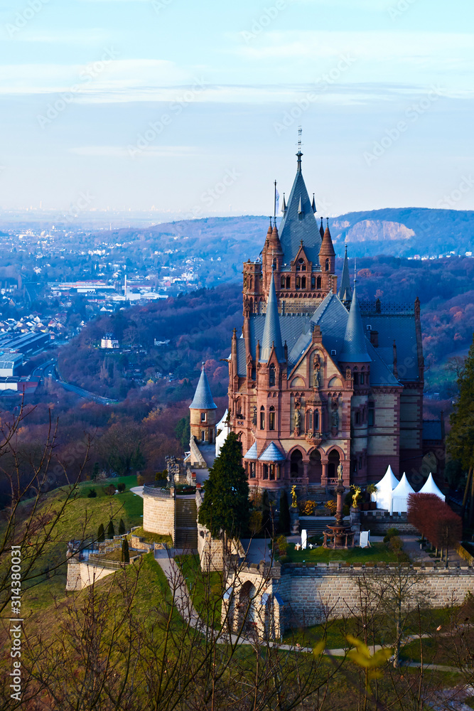 Fototapeta premium Medieval castle - Schloss Drachenburg, big pink palace in Konigswinter. Cloister of knights located on Rhine river near the city of Bonn in Germany