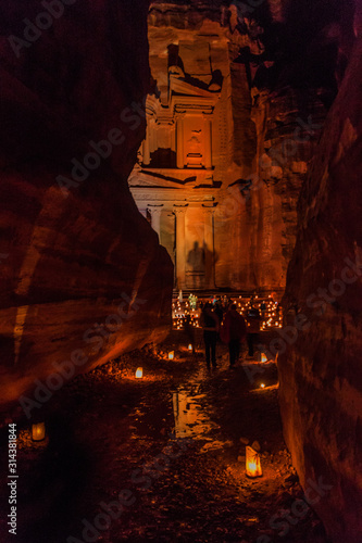 Candles glowing in front of the Al Khazneh temple (The Treasury) in the ancient city Petra, Jordan