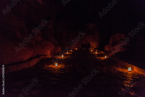 Candels along the Siq (narrow gorge, main entrance to the ancient city Petra) during Petra by Night, Jordan