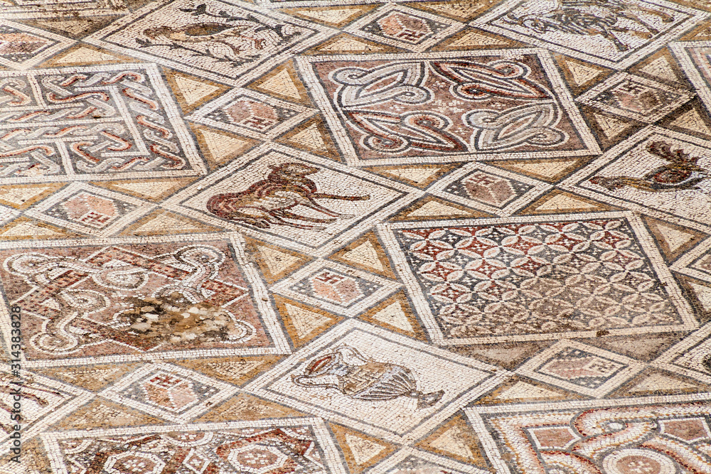 JERASH, JORDAN - APRIL 1, 2017: Mosaics at the church of Saints Cosmas and Damianus ruins at the ancient city Jerash, Jordan JERASH, JORDAN - APRIL 1, 2017: Mosaics at the church of Saints Cosmas and Damianus ruins at the ancient city Jerash, Jordan