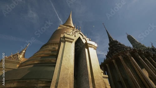 This golden stupa is called Phra Siratana Chedi.  It was erected by King Rama IV in 1855. photo