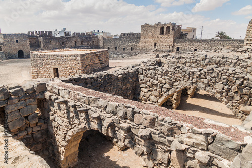 Ruins of Qasr al-Azraq (Blue Fortress), fort located in the desert of eastern Jordan. photo