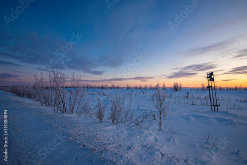 winter landscape with lake and blue sky