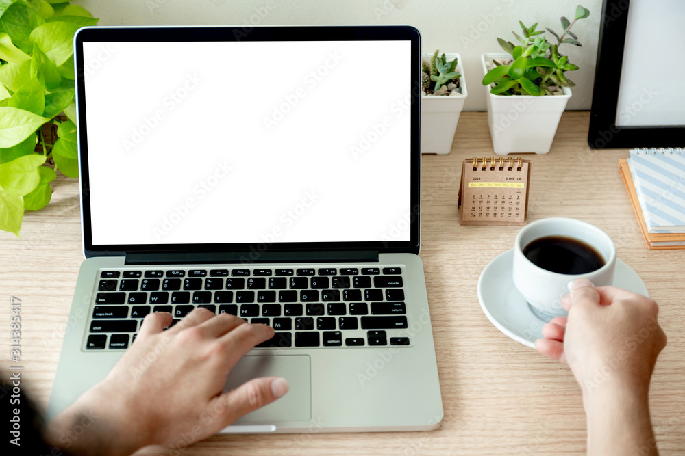 mockup image blank screen computer with white background for advertising text,hand man using laptop contact business search information on desk at coffee shop.marketing and creative design mockup image blank screen computer with white background for advertising text,hand man using laptop contact business search information on desk at coffee shop.marketing and creative design