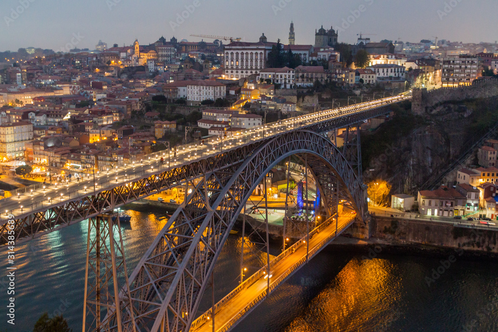 Evening view of Dom Luis bridge over river Douro in Porto, Portugal