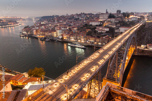 Evening view of Dom Luis bridge over river Douro in Porto, Portugal