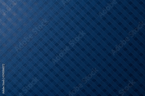 格子模様のエンボス加工のある紙の背景素材