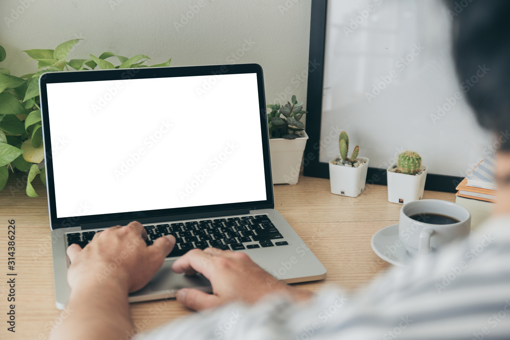 mockup image blank screen computer with white background for advertising text,hand man using laptop contact business search information on desk at coffee shop.marketing and creative design mockup image blank screen computer with white background for advertising text,hand man using laptop contact business search information on desk at coffee shop.marketing and creative design