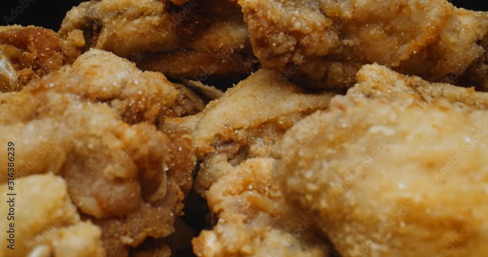 Extreme close up of chicken wings. Shot with a macro probe lens in 4K RAW on a cinema camera. Extreme close up of chicken wings. Shot with a macro probe lens in 4K RAW on a cinema camera.