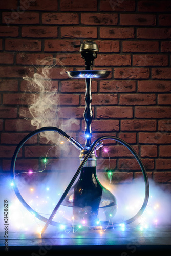 Black hookah in smoke