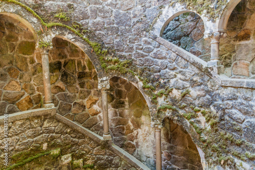 Stairway of Poco Iniciatico (Initiation Well) in Quinta da Regaleira complex in Sintra, Portugal photo