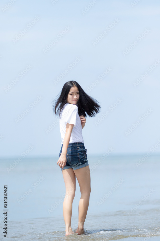 asian teenager relaxing with happiness on vacation sea beach asian teenager relaxing with happiness on vacation sea beach