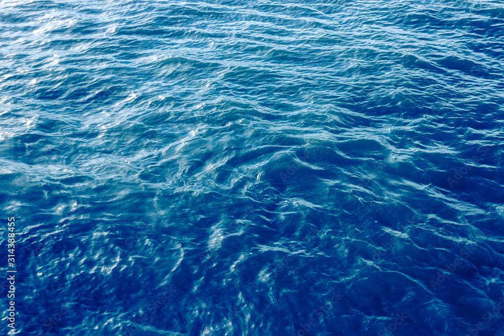 Obraz premium Blue sea wave close up, low angle view for summer background.