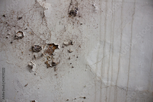 White cracked wall with water seeps. old conception background