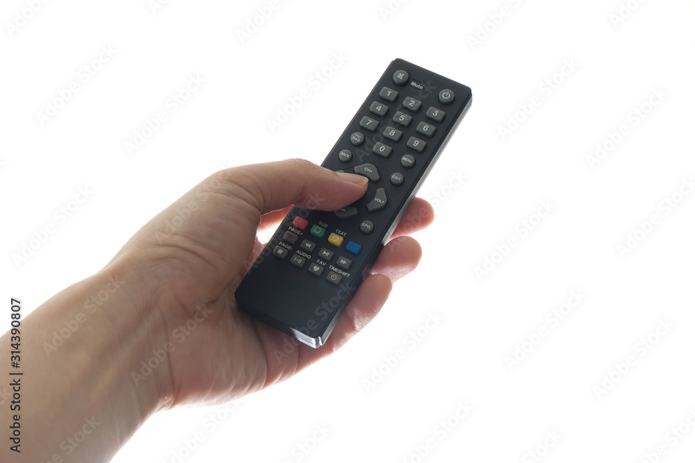 His hand is holding the remote control and operate the remote control. on the White Background . Concept of Technology His hand is holding the remote control and operate the remote control. on the White Background . Concept of Technology