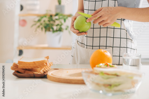 Woman preparing takeaway meal for her family