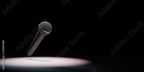 Metallic Microphone Spotlighted on Black Background