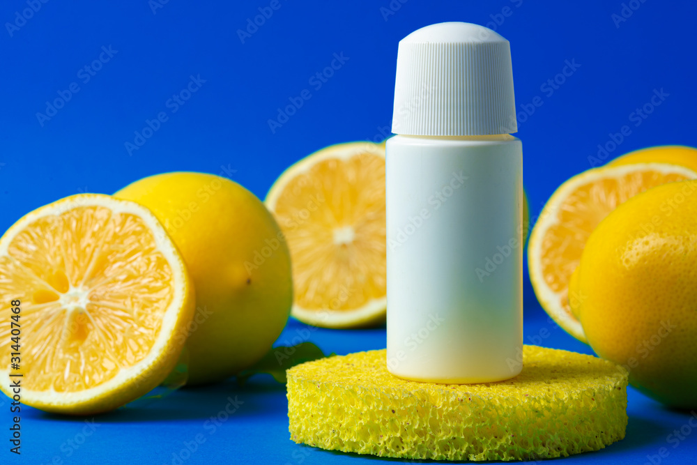 Bottle of skincare cosmetics with sliced lemons Bottle of skincare cosmetics with sliced lemons
