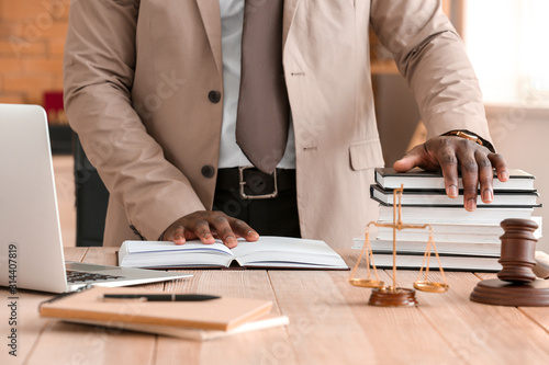 Lawyer with books in office