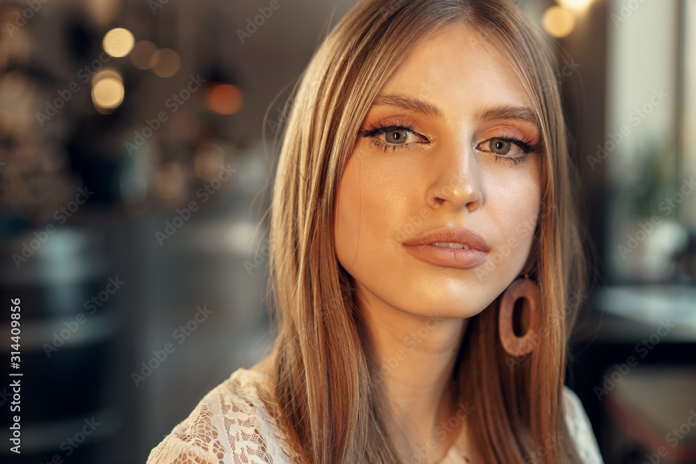 Beautiful female model portrait in a cafe