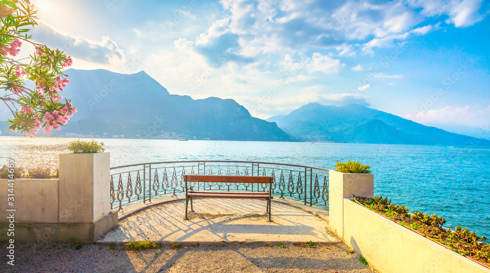 Bench on lakefront in Como Lake landscape. Bellagio Italy - obrazy, fototapety, plakaty 