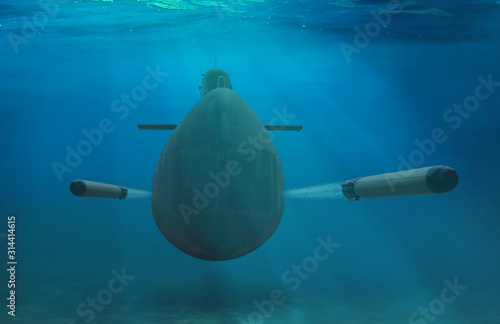 Naval submarine firing torpedoes underwater photo